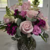 This large, full arrangement features some of the most beautiful garden flowers.