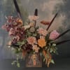 Fall is in the air! This autumn inspired arrangement is designed in