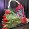 An elegant clear bag with 30 stems of Holland tulips .3 BUNCHES