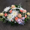 peach roses, white spider mums, snap dragons, carnations