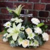 This peaceful all white bouquet features a beautiful crystal cross as the