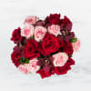 This arrangement includes purple cymbidium orchids, red roses, &amp; pink roses. Truly