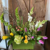 A striking display of spring blooms arranged in the low stylish green
