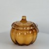 This pumpkin-shaped glass candle with a lid brings a cozy, autumnal vibe