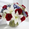 The Glorious Peace is made with red roses, white Asiatic lilies, and