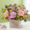  The spring bouquet Pastel pink and yellow blooms are loosely gathered