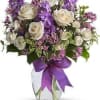 White roses and fragrant stock in lavender and purple arranged in a