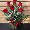 6 Red roses arranged in a vase with baby&#039;s breath &amp; bow.