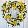 Yellow orchids, yellow spray roses, white spray roses, yellow berries, white lisianthus