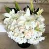 White flowers as shown arranged in a vase. Photos shown are Standard