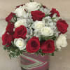 24 White and Red roses arranged in a glass cube.
