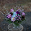 Nested in seasonal foliage are cool indigo and blue toned floral varieties