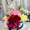 Cup of coffee with beautiful fresh seasonal flowers.