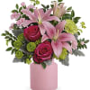 Lush blush blooms and a charming frosted glass jar make this a