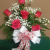 1/2 dozen bright and beautiful hot pink Roses mixed with seasonal filler.