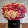 Indulge in the romance of Lady P, a stunning floral arrangement overflowing
