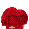 This romantic masterpiece features a lush and velvety ensemble of red roses