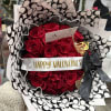 A 25 count bouquet of red roses is wrapped in Coach-patterned paper