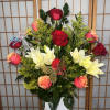 Beautiful arrangement of roses in the color of your choice and lilies
