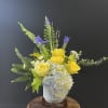 Bright yellows and purples in a modern gray footed pot.
