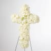 An all white tribute, this white cross funeral spray is pure and