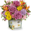 This delightful arrangement features vibrant orange alstroemeria, lavender carnations, miniature pink carnations