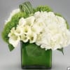 Gorgeous combination of white flowers as white cala lilies, white roses and