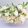 This bouquet? Straight-up timeless elegance. Soft whites, creamy roses, and fresh green