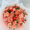 The &quot;Sunset Roses Bliss Bouquet&quot; is a vibrant hand-tied arrangement that captures