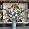 Elevate your space with the &quot;Grand Lavender Elegance Vase.&quot; This magnificent arrangement