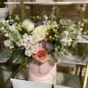 A pastel or colorful flowering hat box brings peace to any space.
