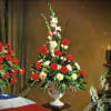 A crimson farewell to a life well lived. This arrangement of red