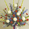 Featuring a variety of popular spring flowers in red, white, and blue