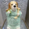  A charming sugar jar featuring a cozy golden retriever in a