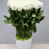 50 beautiful premium Ecuadorian white roses stand tall in this ceramic vase.