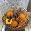 A handcrafted basket filled with citrus-scented potpourri for a fresh ambiance.