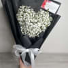 This delicate and romantic arrangement, shaped like a heart, is filled with