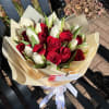 The intensity of red roses blends with the delicacy of white tulips