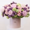 The arrangement includes the following flowers; peonies, lilacs, spray roses and hydrangea.