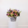 Arrangement comes with the following flowers; hydrangea, lilac, tulips, spray roses, with