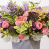 Arrangement comes with the following flowers; hydrangea, lilac, tulips, spray roses, with