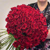 This stunning bouquet features 100 vibrant red roses. Each rose exudes passion