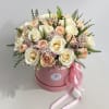 Lavish bouquet featuring three dozen white and pink roses nestled in a