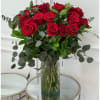 &ldquo;A stunning bouquet of 24 long-stemmed red roses arranged in a clear