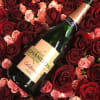 roses and champagne in a low wood box