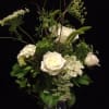Pure white roses with additional soft soothing accents to express your sympathies