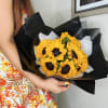 For sunflower lovers.  Vibrant sunflowers wrapped in black paper, creating a