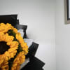 For sunflower lovers.  Vibrant sunflowers wrapped in black paper, creating a