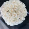 Perfectly arranged White Cream Vendella Roses in a Black Ceramic container (
