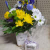 Bee Happy mason jar filled with iris, daisys, green buttons, yellow chrysanthemums
